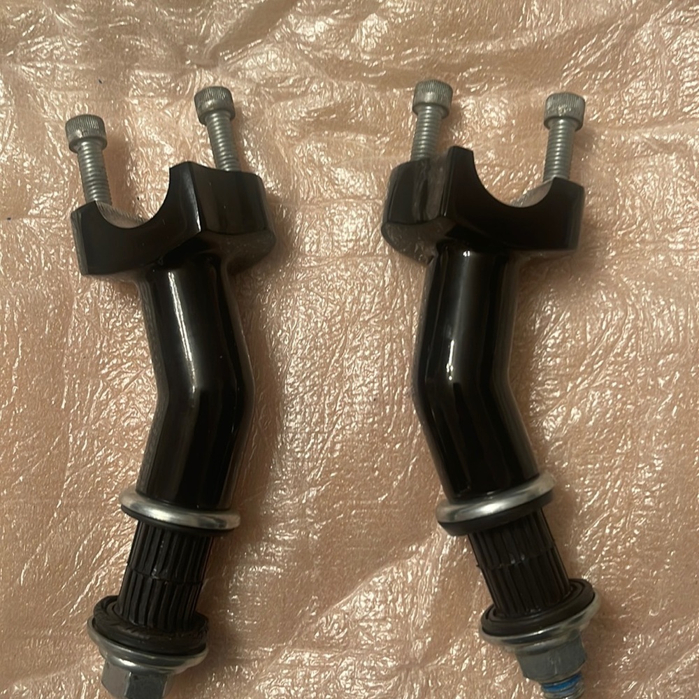Like new 4 inch Harley Davidson pull back handle bar risers!